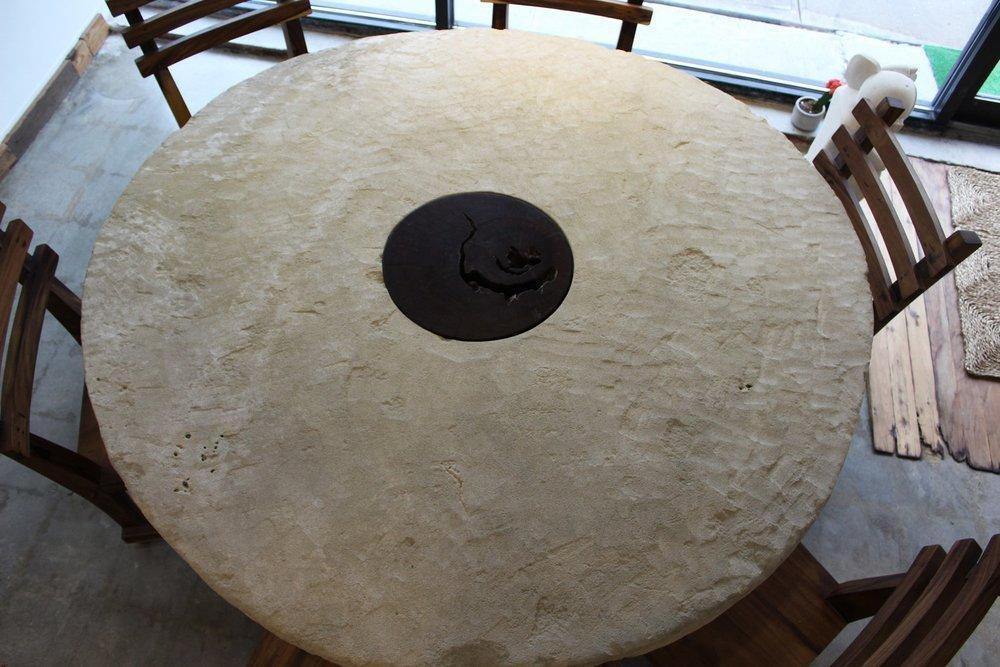ARKA Living In and out limestone table on tree trunk