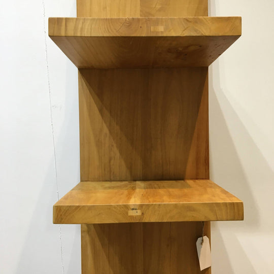 Modern primitive leaning bookshelf